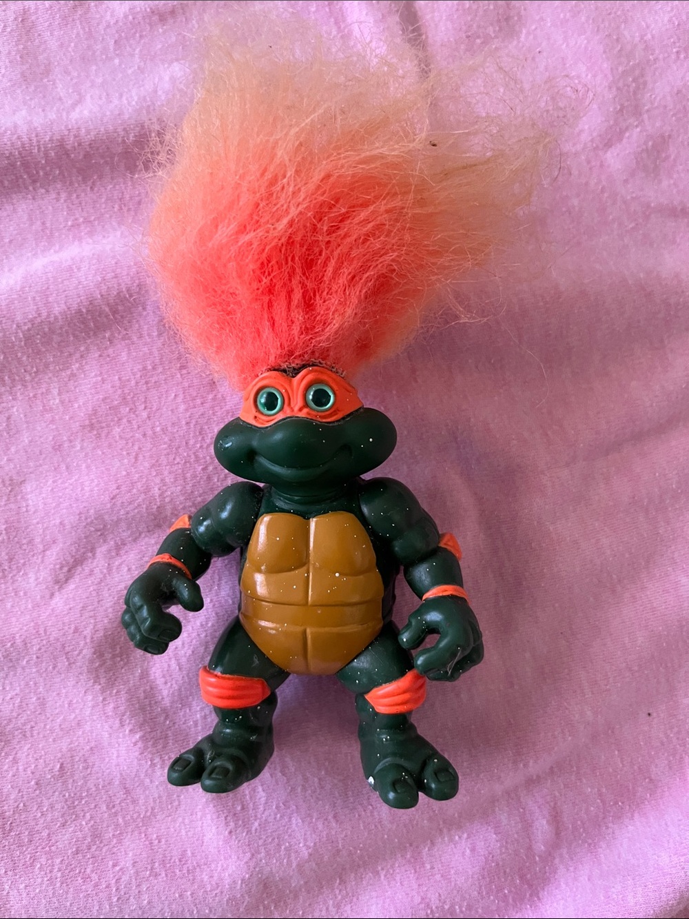 Green Turtle Action Figure with Orange Hair and Accents